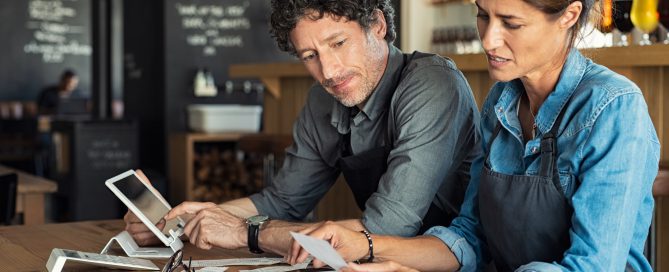 Staff calculating restaurant bill