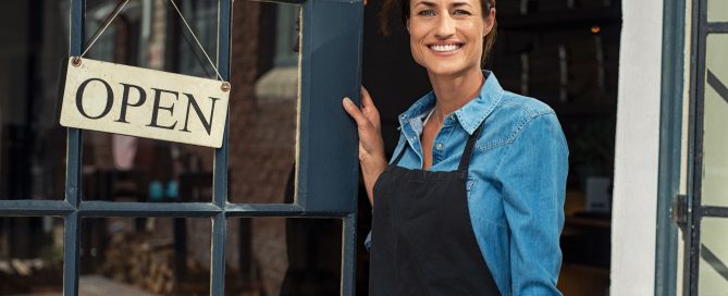Woman at small business entrance